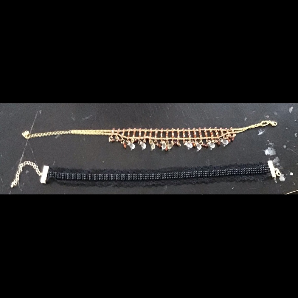 Two chokers with adjustable clasps